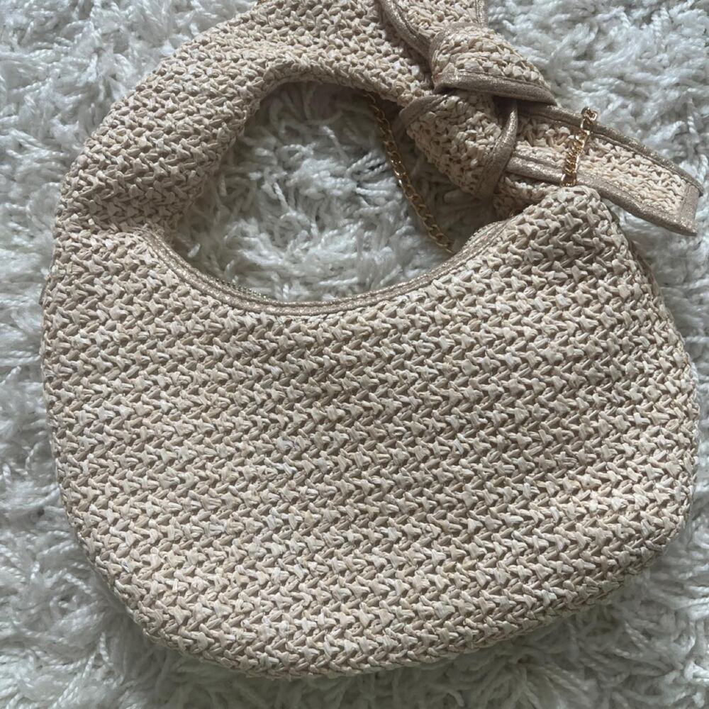 Cream woven straw handbag with bow handle